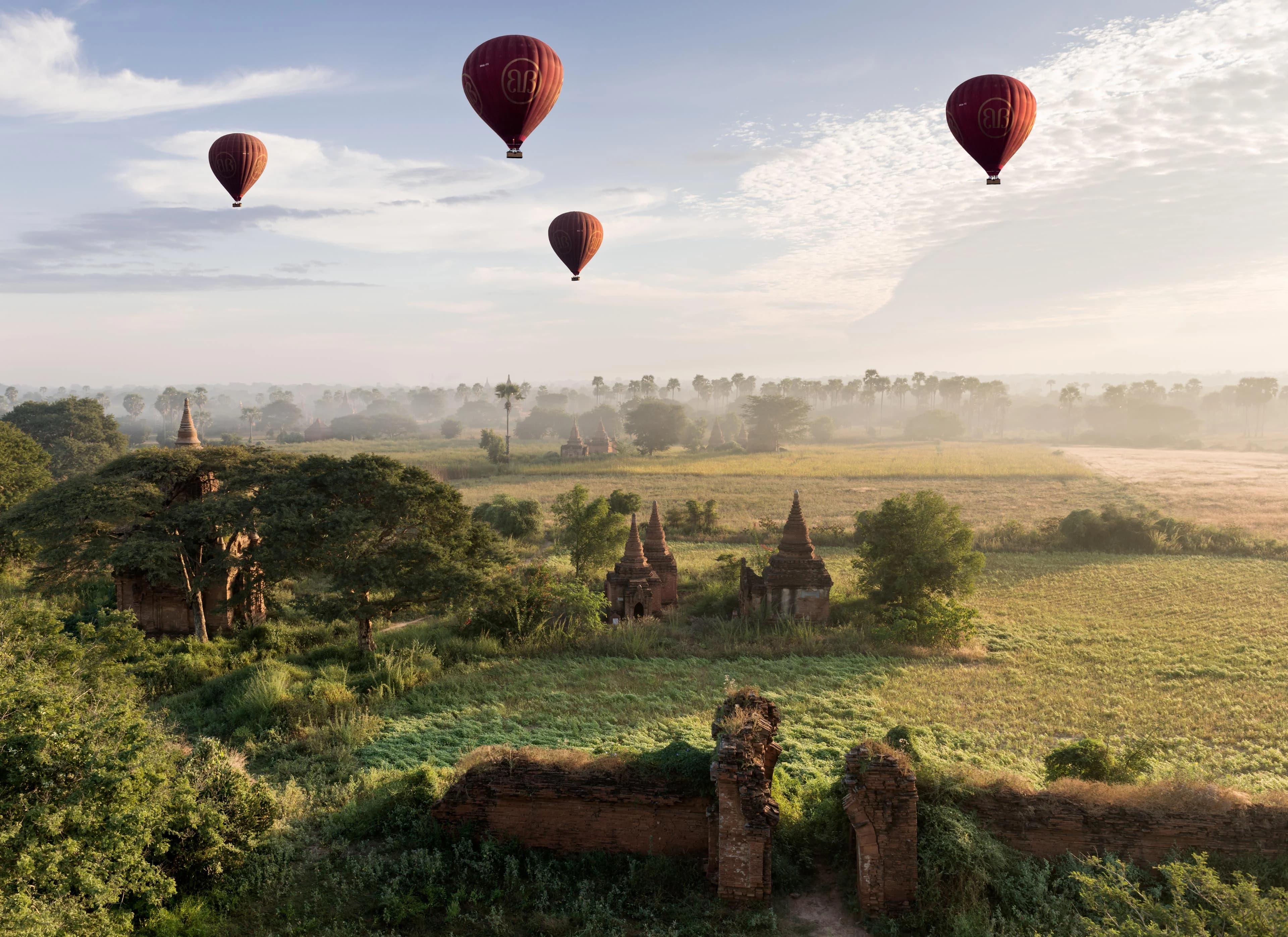 Hot air balloons over ancient temple ruins in Bagan, Myanmar
