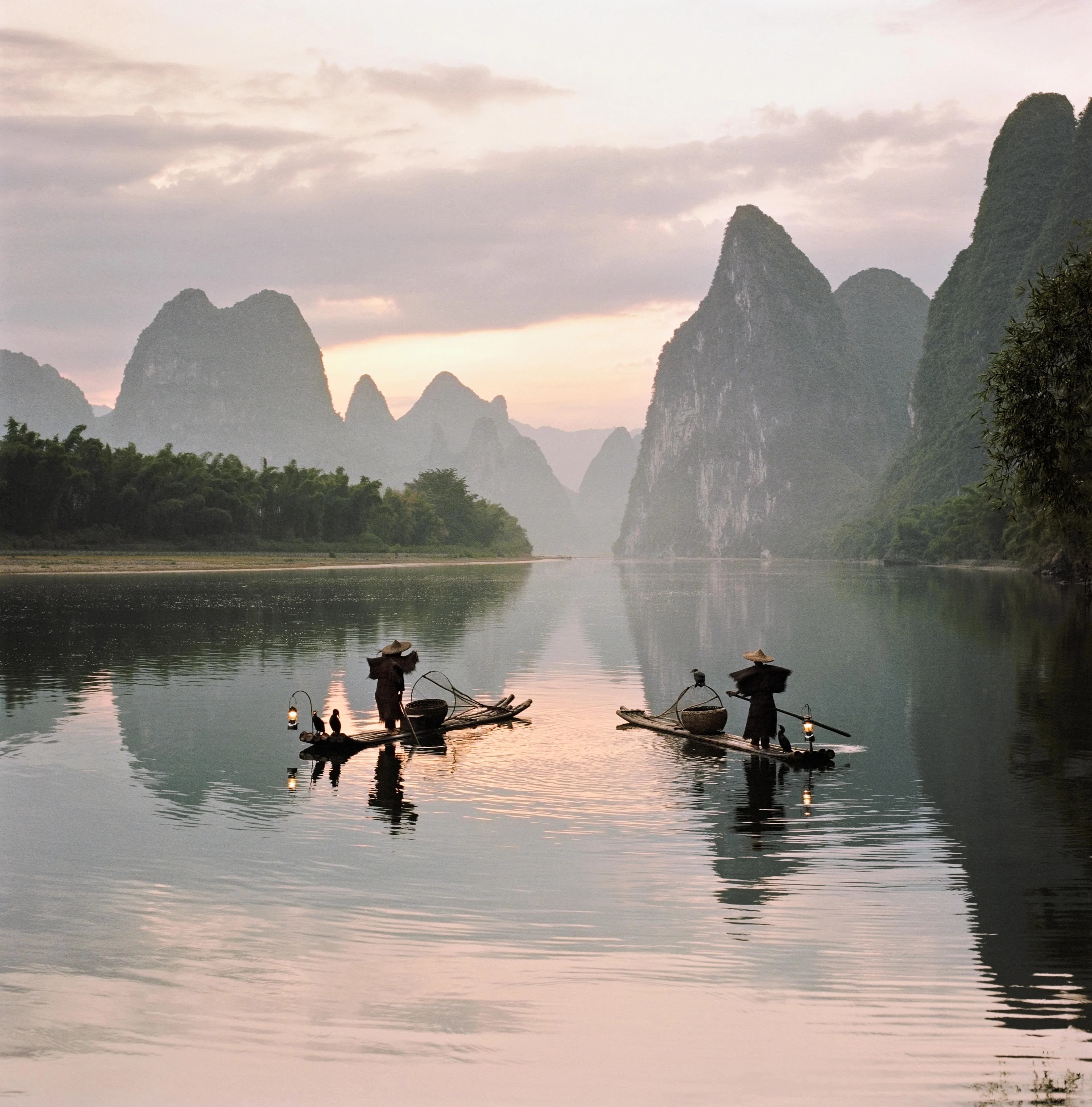 Fishermen on the Li River at dawn